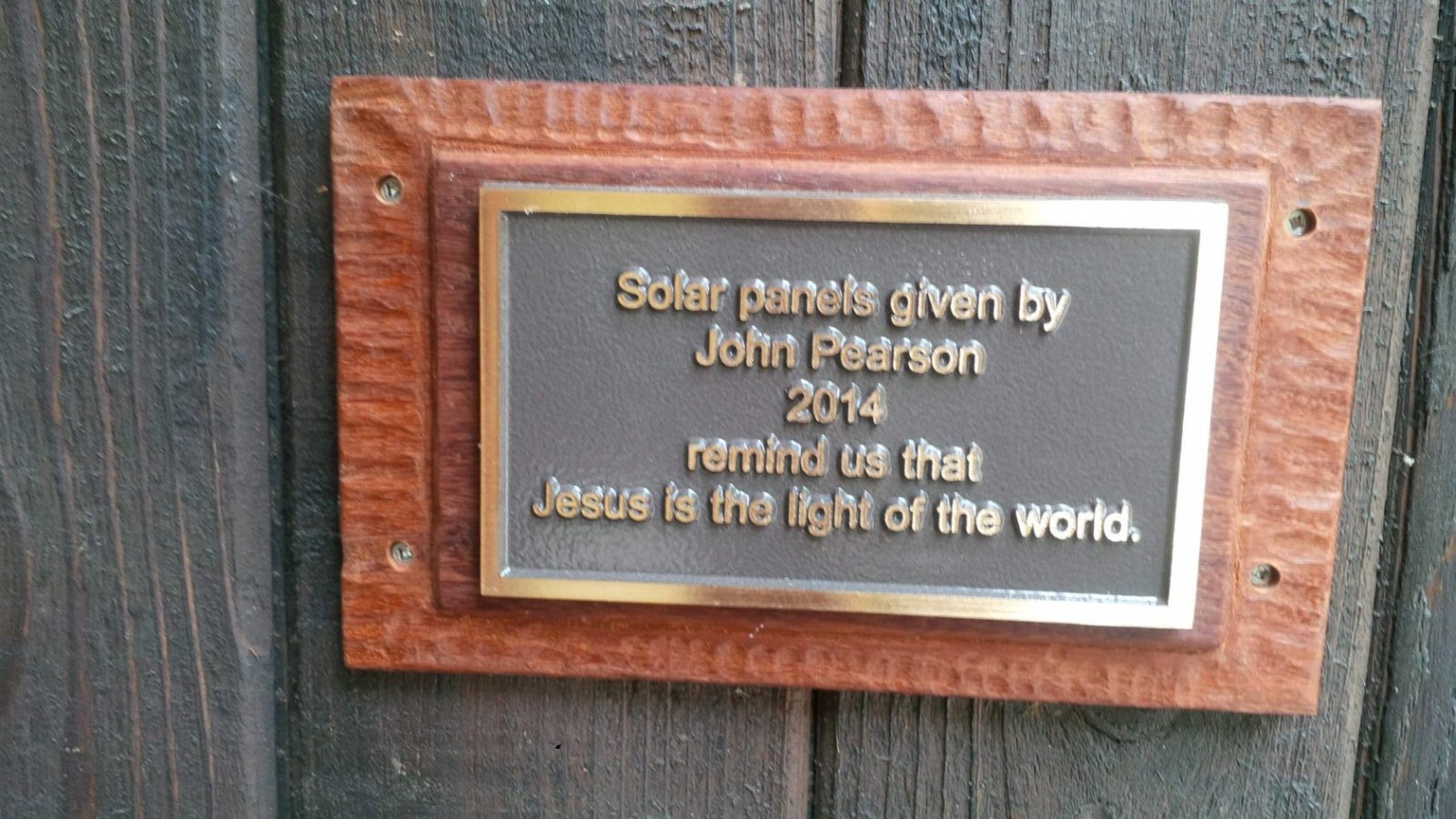 Placque saying that the solar panels were given by John Pearson.