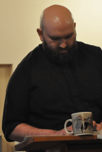 Fr. Jed Fox with a cup of coffee.