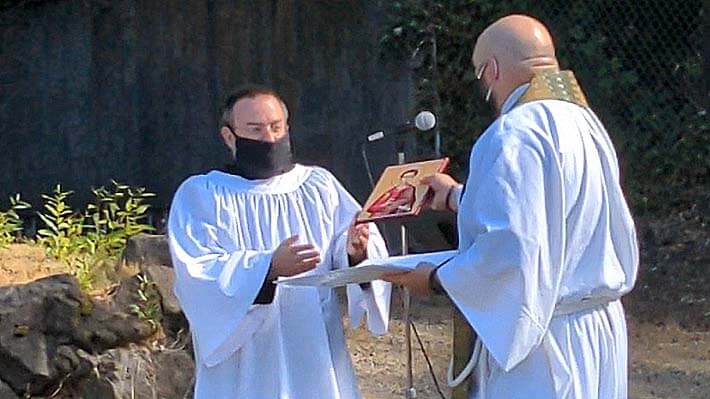 Fr. Jed Fox presenting icon of Phillip to Phillip Lienau