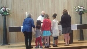 Church School participating in the offertory procession in 2018