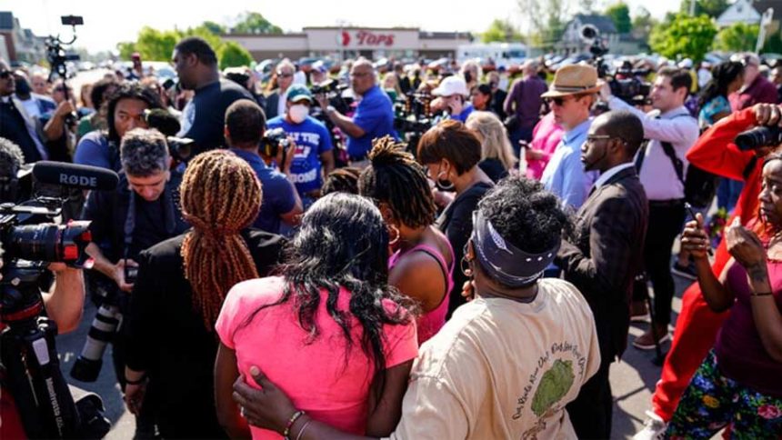 People gather outside the scene of a shooting at a supermarket in Buffalo, New York, on May 15, 2022. Photo, Associated Press.