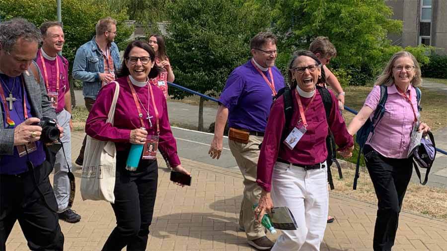 Bishops and spouses march across the campus of the University of Kent in Canterbury, England, on July 27, 2022, during the Lambeth Conference. Photo: Egan Millard-Episcopal News Service