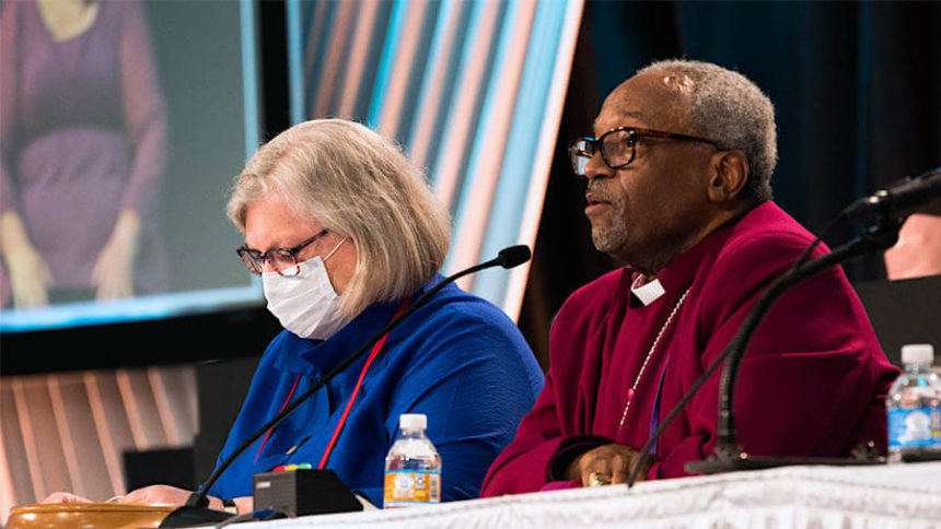 The Rev. Gay Clark Jennings, who ended her term as president of the House of Deputies July 11 at the end of the 80th General Convention, and Presiding Bishop Michael Curry listen July 10 during the convention’s budget presentation. Photo: Scott Gunn.