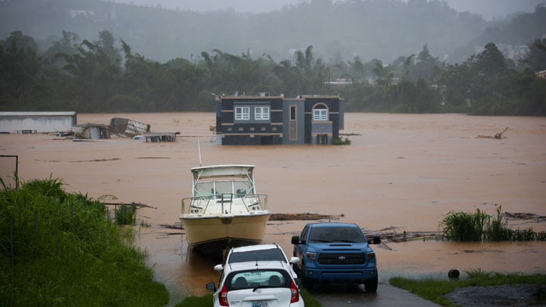 A home is submerged in floodwaters caused by Hurricane Fiona in Cayey, Puerto Rico, on September 18, 2022--Photo-Associated Press
