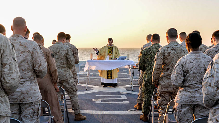 Military chaplain leading a worship service