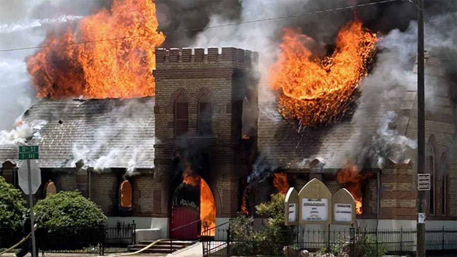Flames burn through the roof of St. Stephen's Episcopal Church in Douglas, Arizona, in a May 22, 2023, fire that destroyed the building. Photo: Brad Munroe