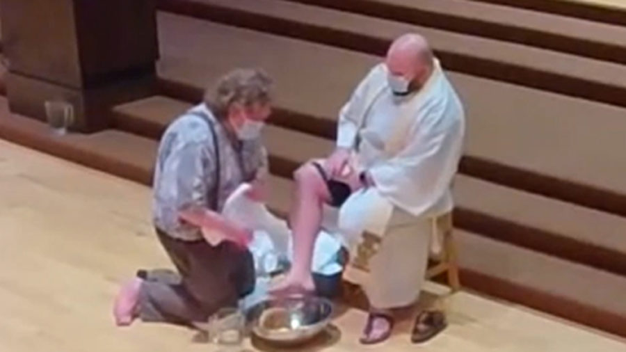 Father Jed having his feet washed on Maundy Thursday in 2023.