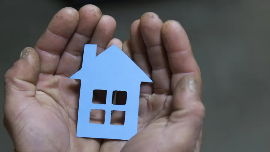 Graphic device for Lake City Partners of a pair of hands holding a house