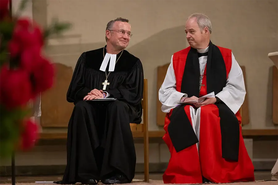 Bishop Christian Kopp, head of the Evangelical Lutheran Church in Bavaria, left, and Presiding Bishop Sean Rowe, right
