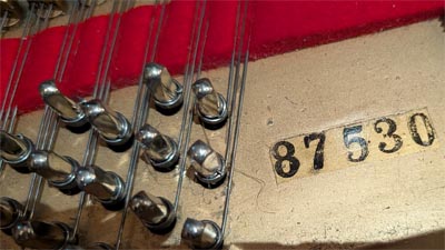 Serial number of our piano showing the careful restringing restoration