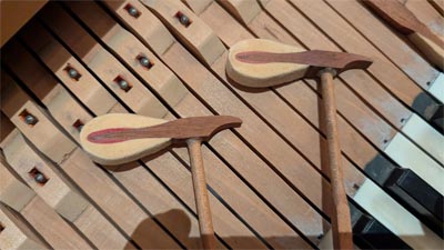 Treble hammers showing little felt left